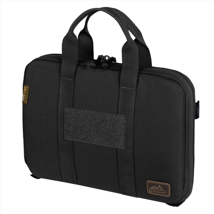 Czarne etui na portfel na pojedynczy pistolet Helikon-Tex wykonane z nylonu Cordura z wyściełanym wnętrzem i podwójnymi uchwytami do bezpiecznego przechowywania broni krótkiej